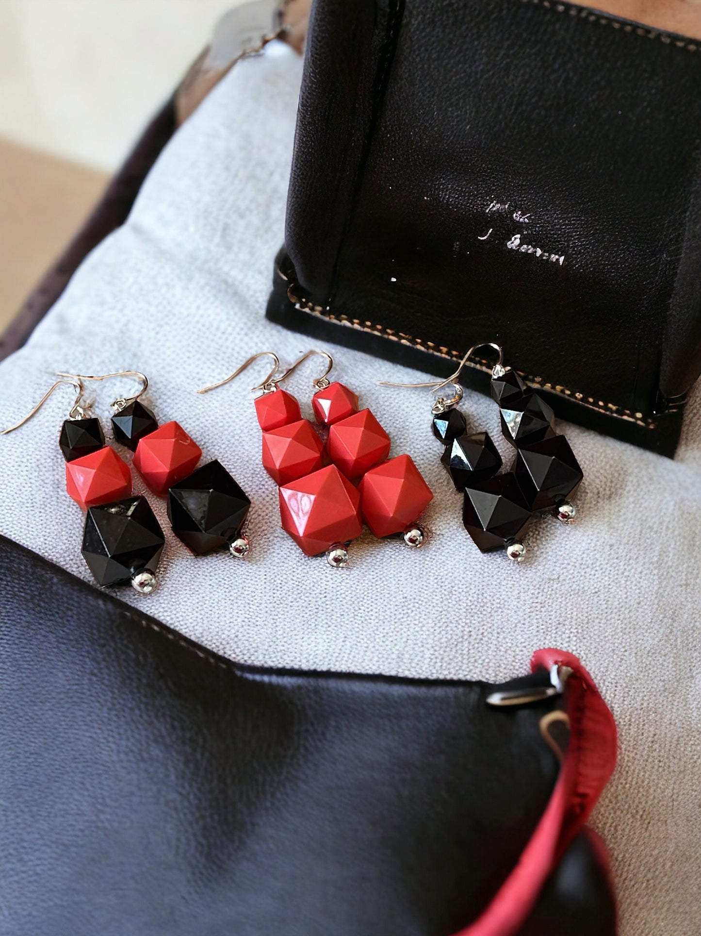 Your choice of coral or black faceted dangle earrings