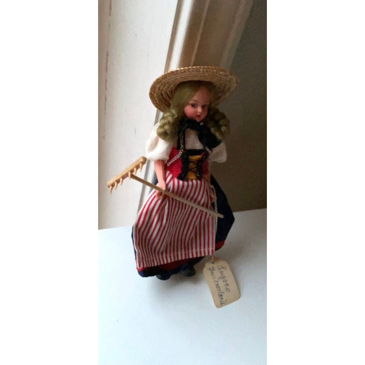 Vintage collectible handmade doll from Luganos Switzerland - with traditional handmade clothing and wooden rake