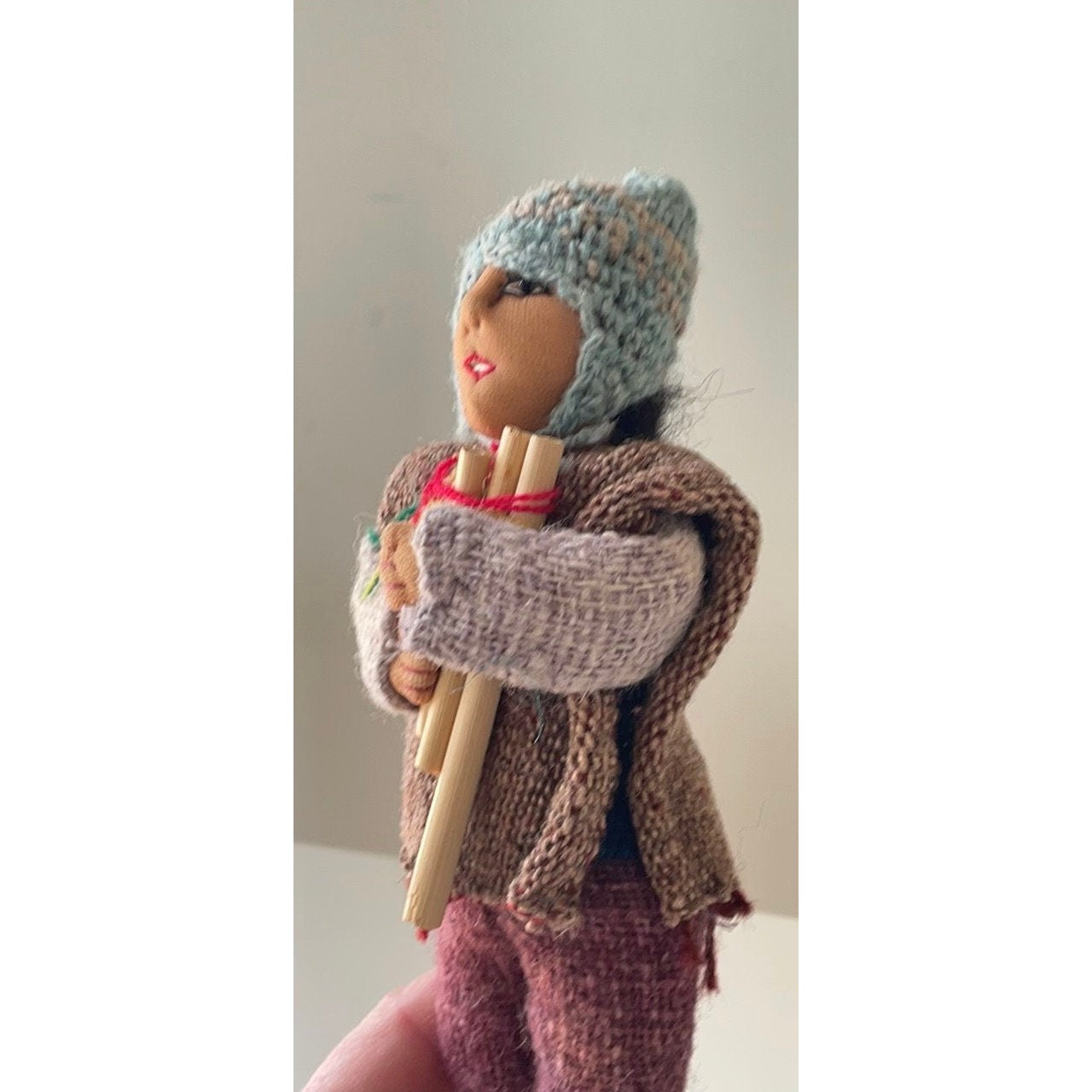 Vintage Bolivian man playing panpipes - collectible folk art doll with handmade woven wool clothing