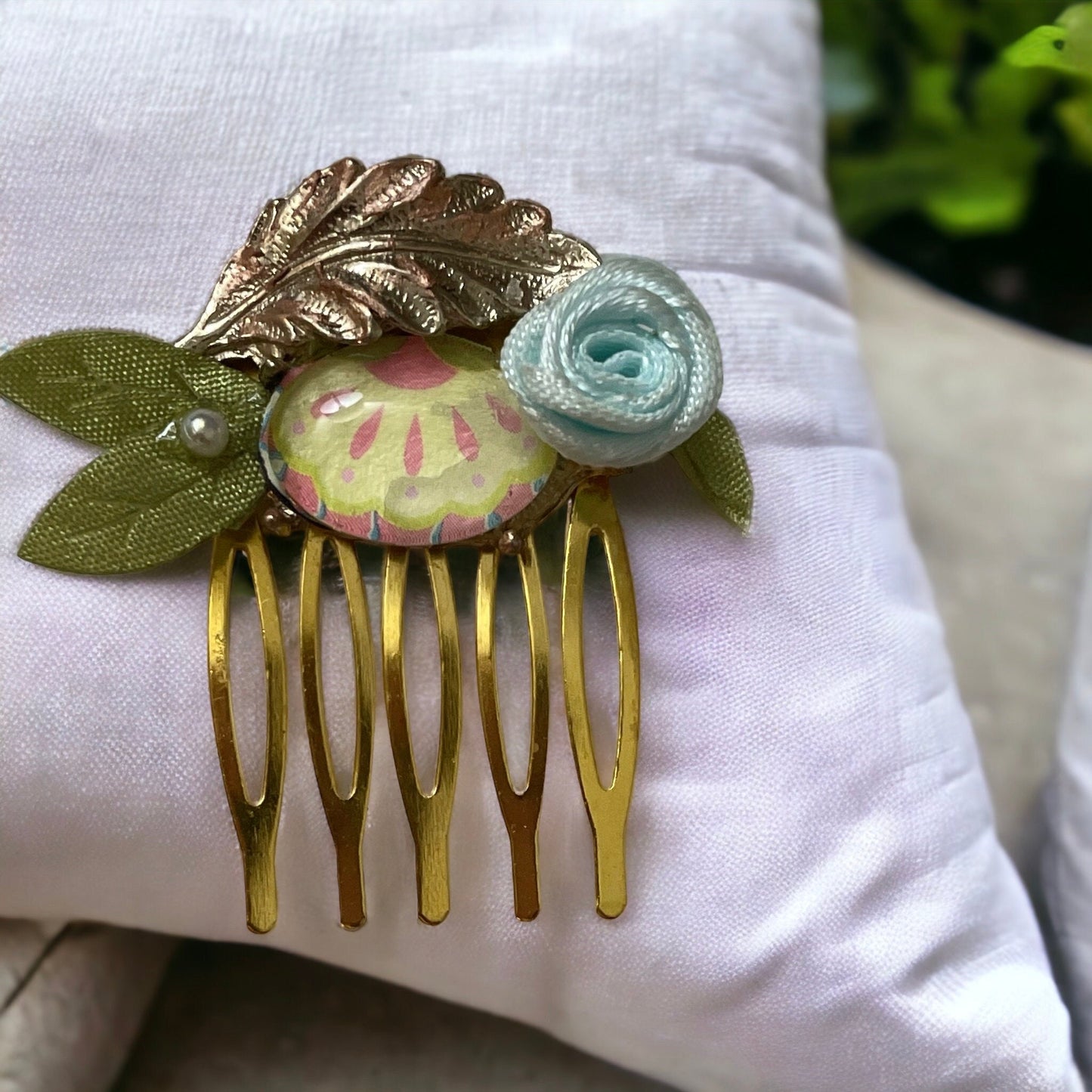 Garden inspired mixed material small 1" hair comb with antiqued metal leaf, paper sealed glass cabochon, satin flower/leaves