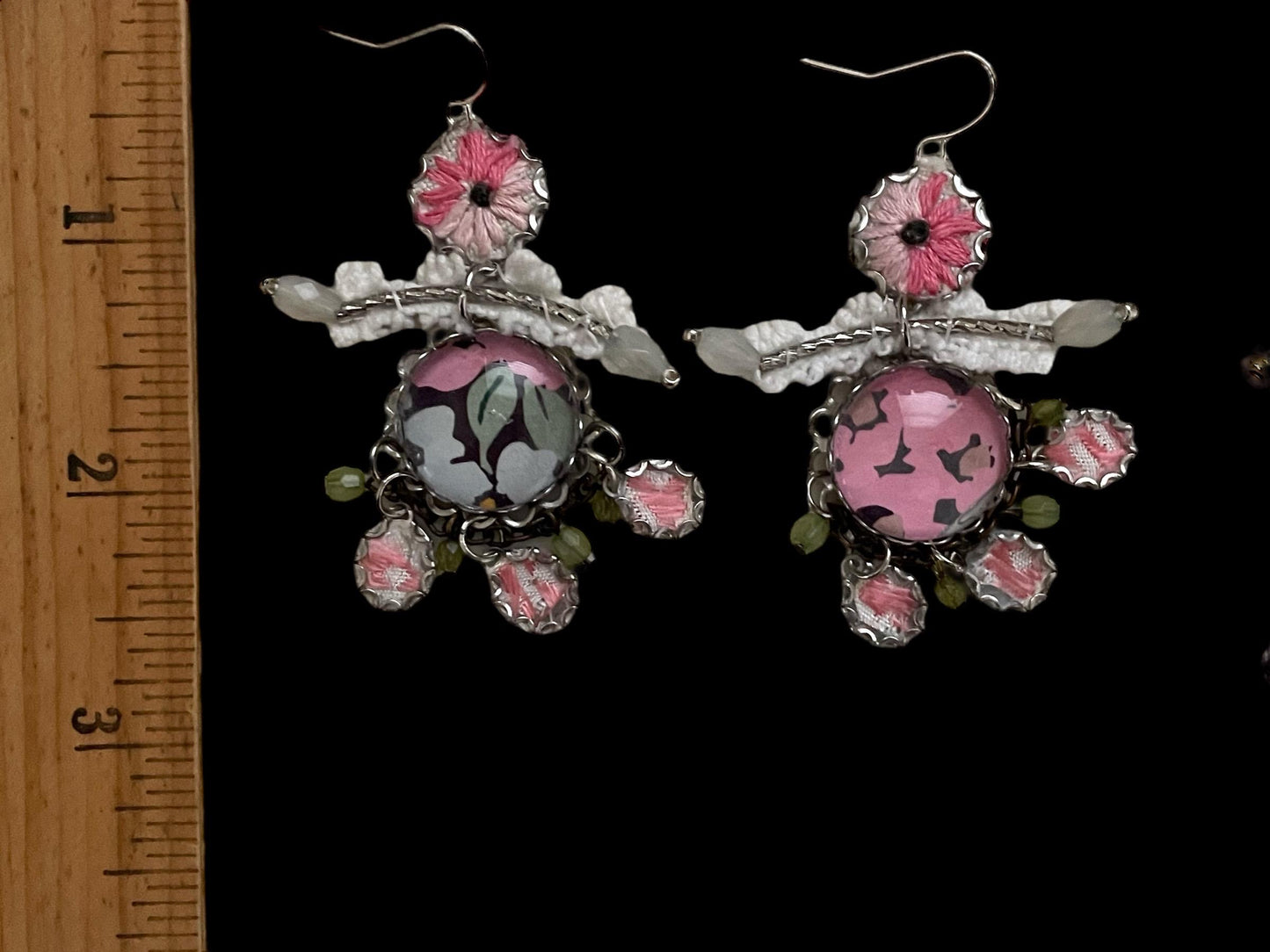 Mixed media earrings made with vintage crochet lace, embroidery from a vintage linen table runner, paper, satiny ribbon and mixed metals