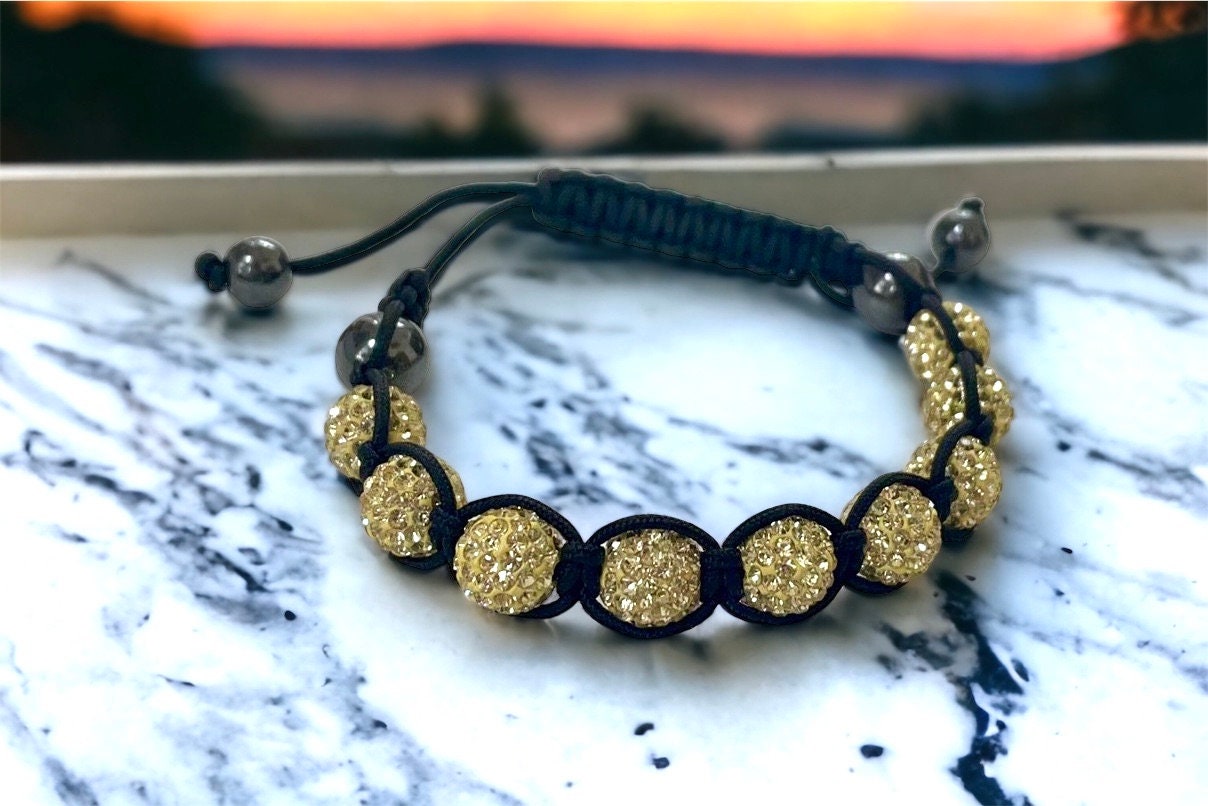 Sparkly black and yellow goldtone bracelet with hematite beads - adjustable