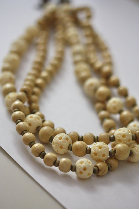 Mixed wood and carved bovine stunning triple stranded vintage necklace on leather cord