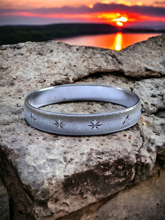Vintage silvertone bangle bracelet with etched stars