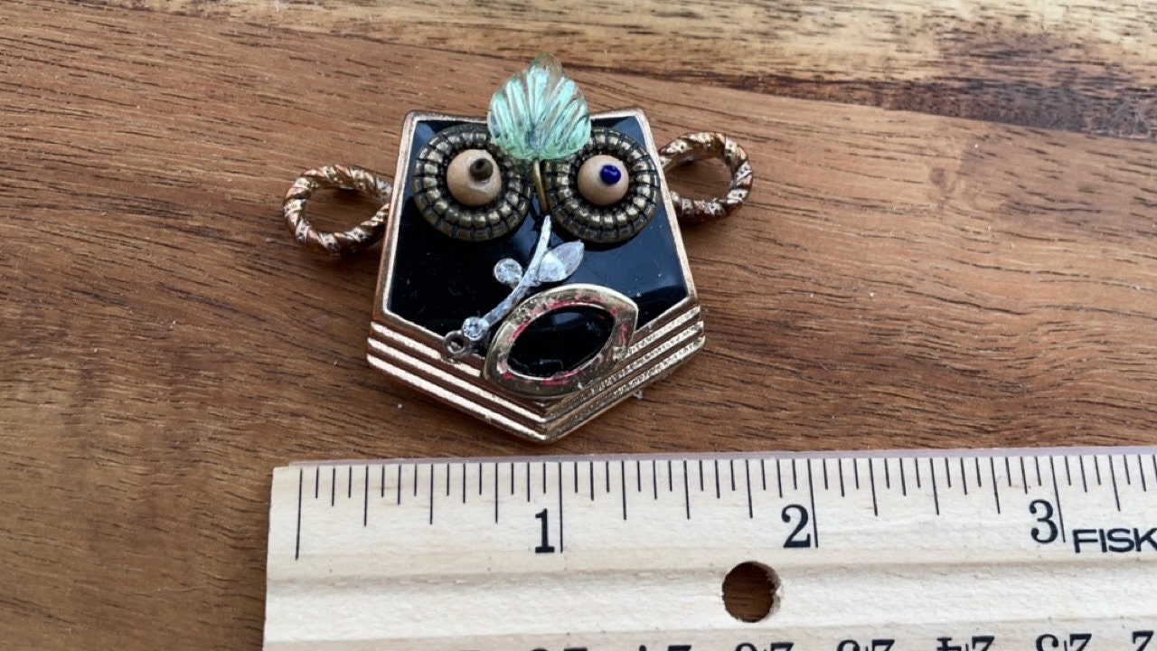 This monkey is a really cool assemblage art piece - it can be transformed into a necklace pendant, pin, magnet, small ornament or ring