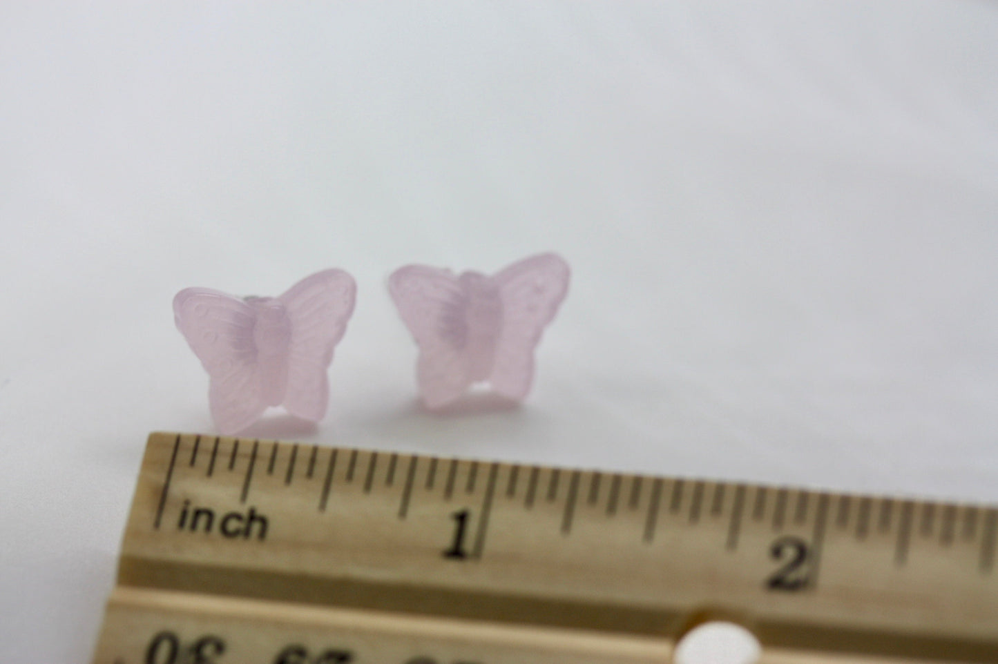 Small little light pink butterfly stud earrings
