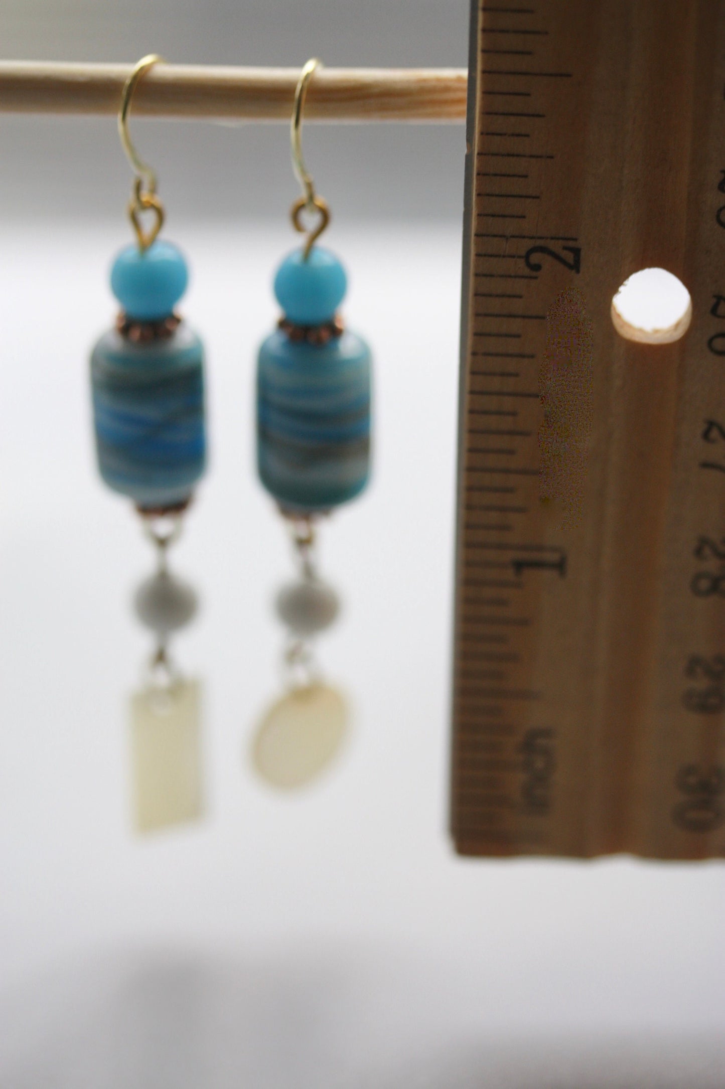 Long dangle earrings made of both new and vintage components -blue and gold art glass, mother of pearl dangles,vintage blue and white beads