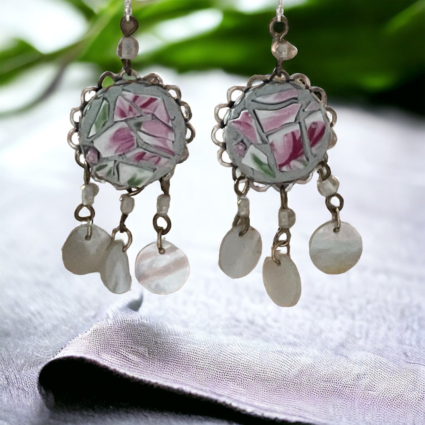 Unique earrings made of hand cut mosaic tile from vintage plates combined with mother of pearl dangles