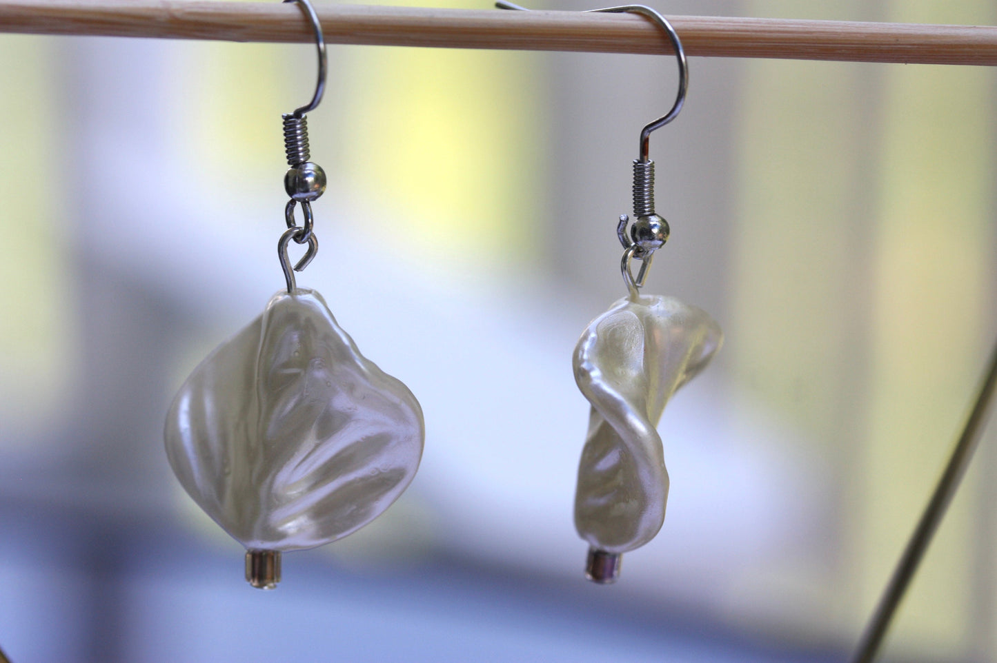 Pearlescent leaves dangle earrings trimmed with tiny sparkly seed beads
