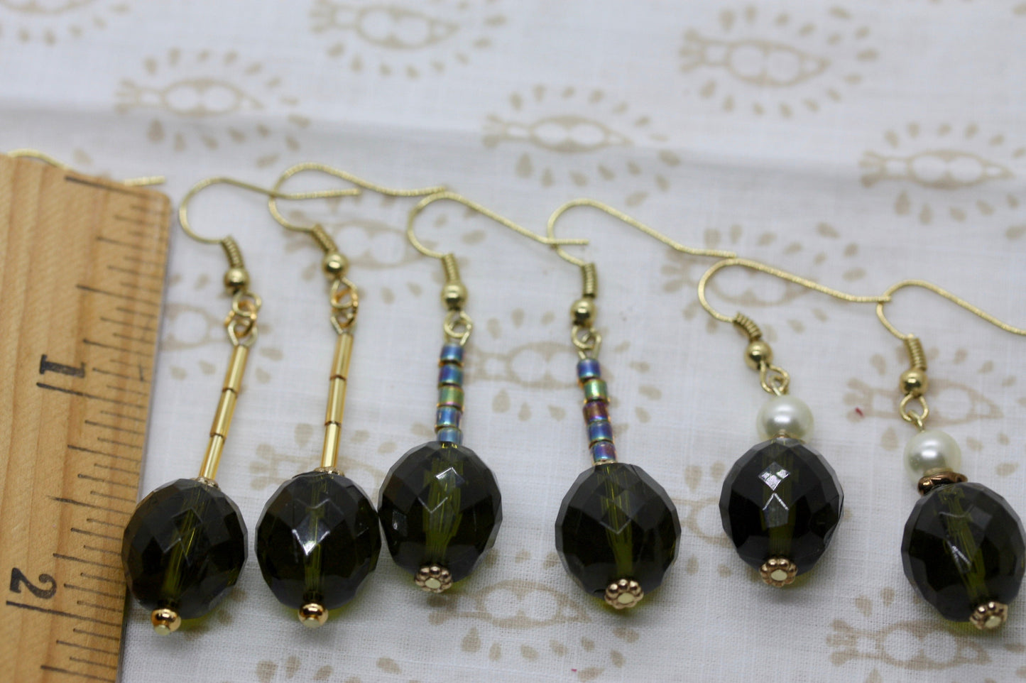 Your choice of faceted  green glass dangle earrings