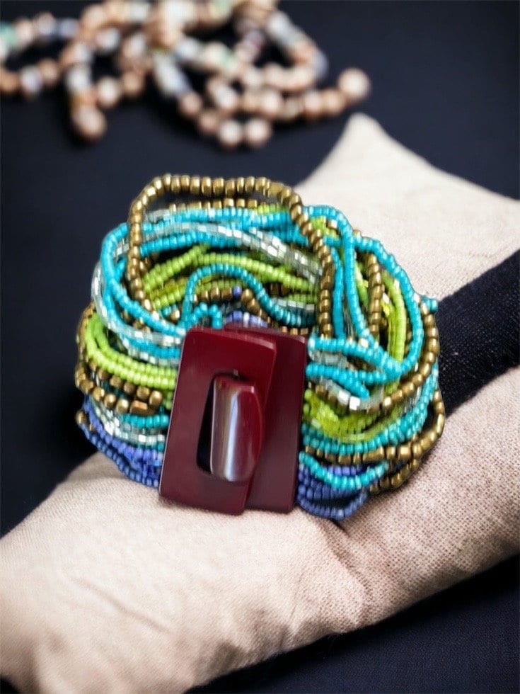 Stunning vintage bracelet - loaded with dozens of strands of tiny glass beads - plastic or bakelite closure?