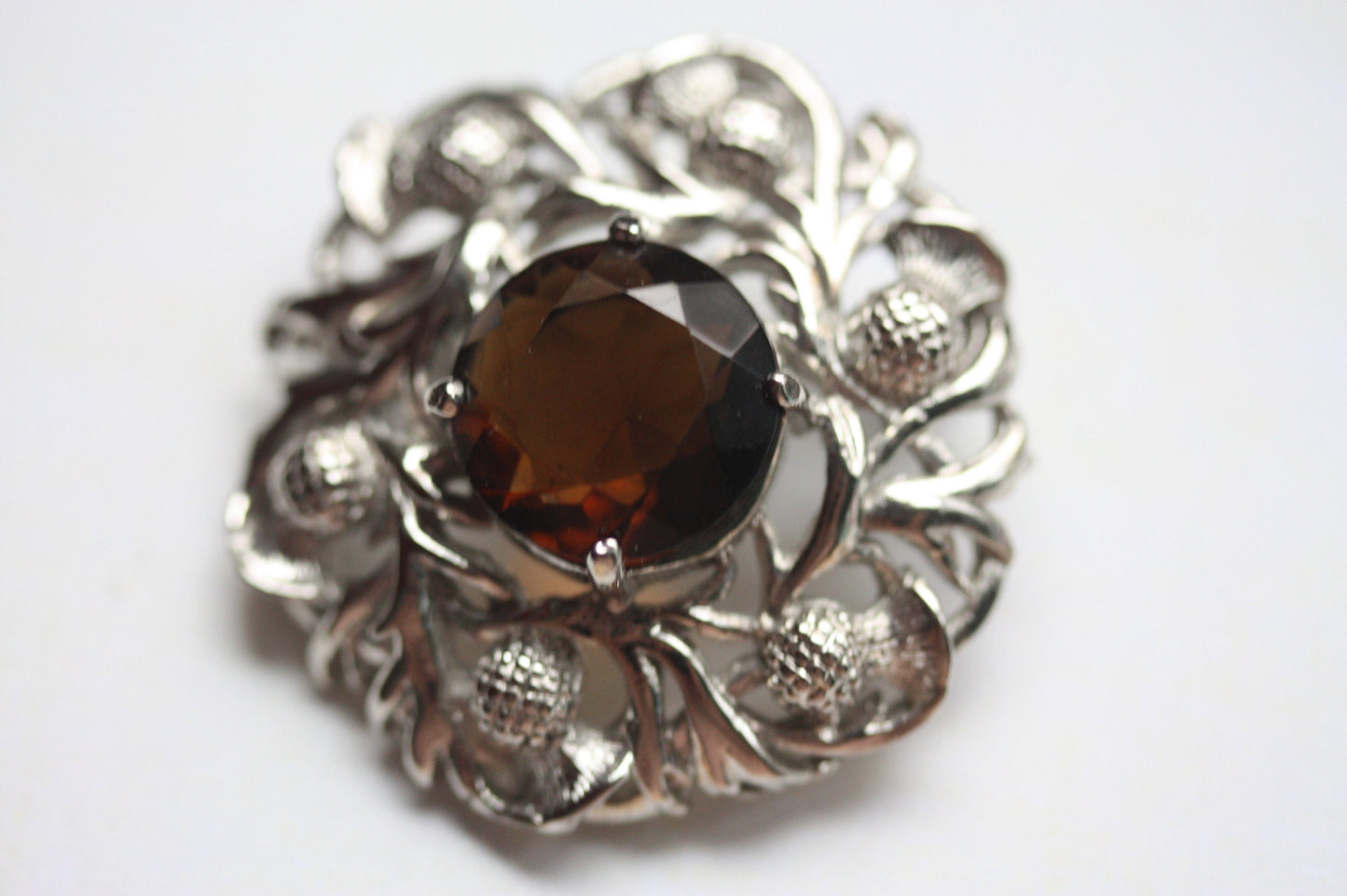 Stunning vintage pin with faceted center