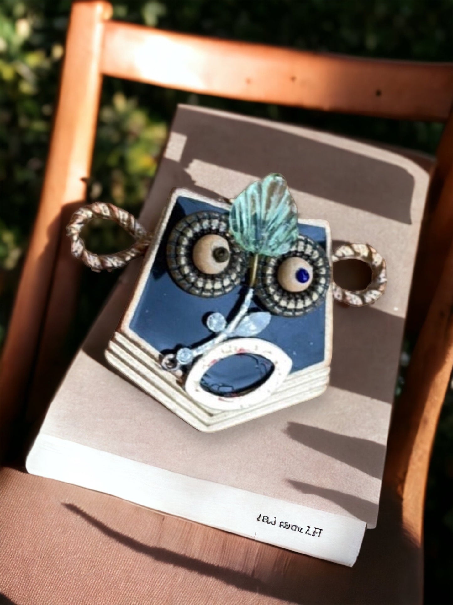 This monkey is a really cool assemblage art piece - it can be transformed into a necklace pendant, pin, magnet, small ornament or ring