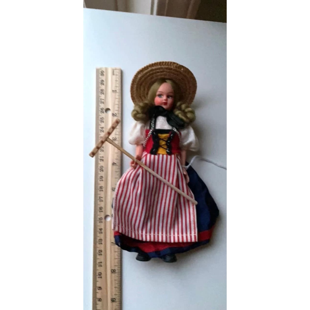 Vintage collectible handmade doll from Luganos Switzerland - with traditional handmade clothing and wooden rake