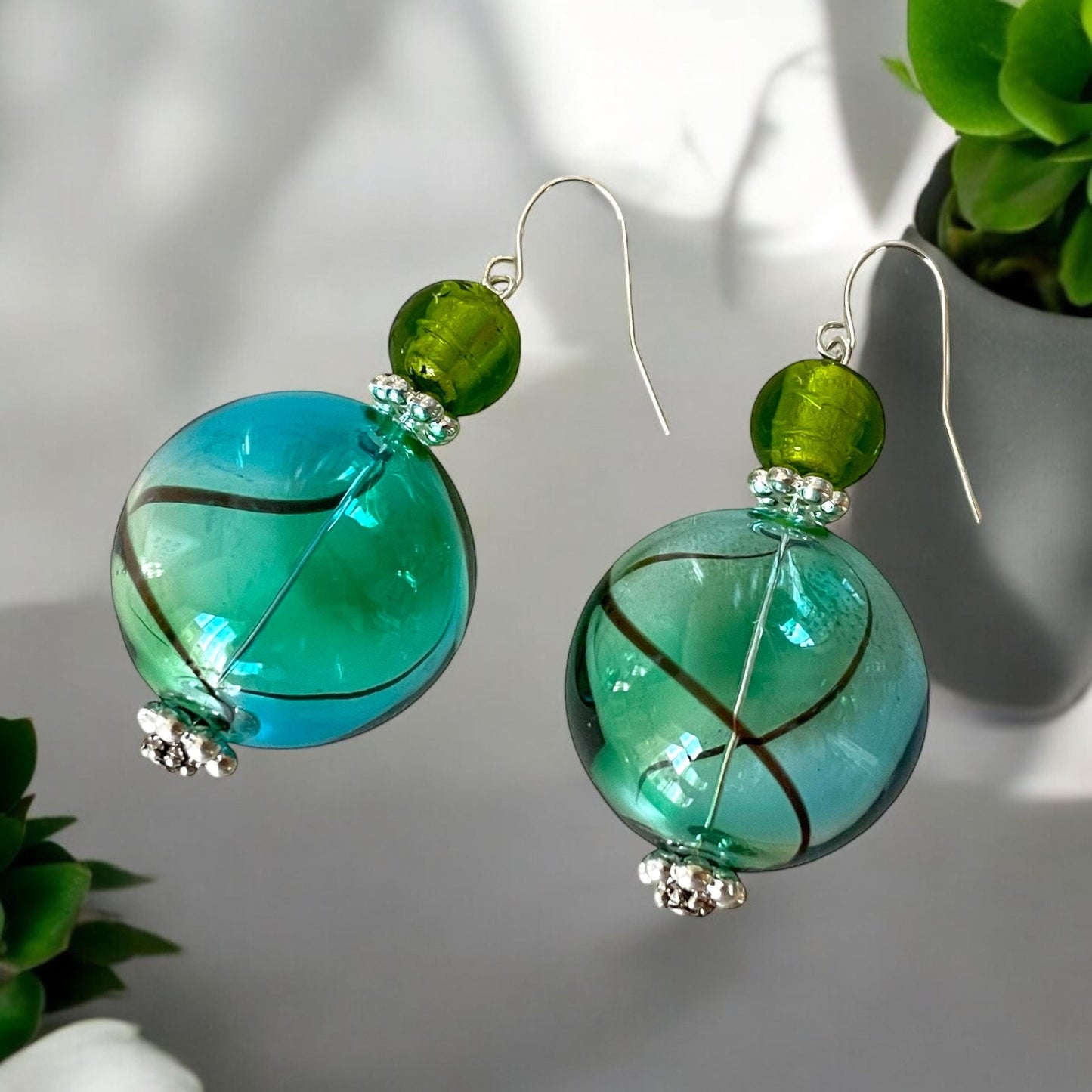 Shades of green and blue blown glass dangle earrings