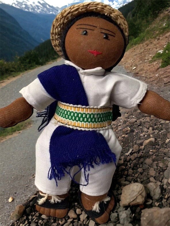 Stunning vintage Mexican girl doll with braids and authentic clothing with straw hat