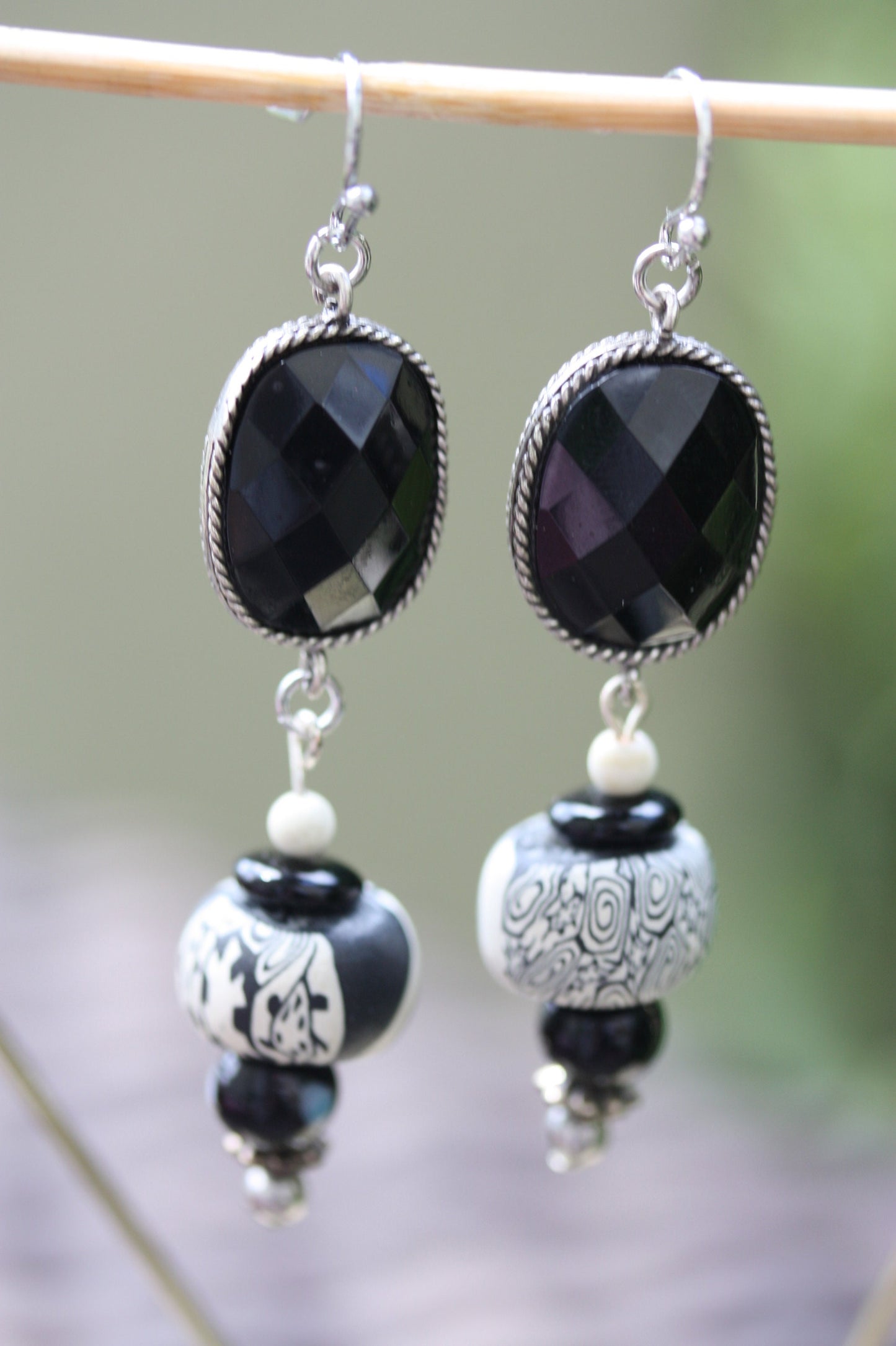 Black and white mixed media earrings made of upcycled polymer clay, combined with vintage black faux crystal, metal and glass spacer beads