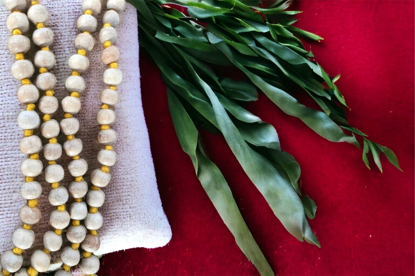 Knotted natural wood prayer bead necklace with golden yellow tassel