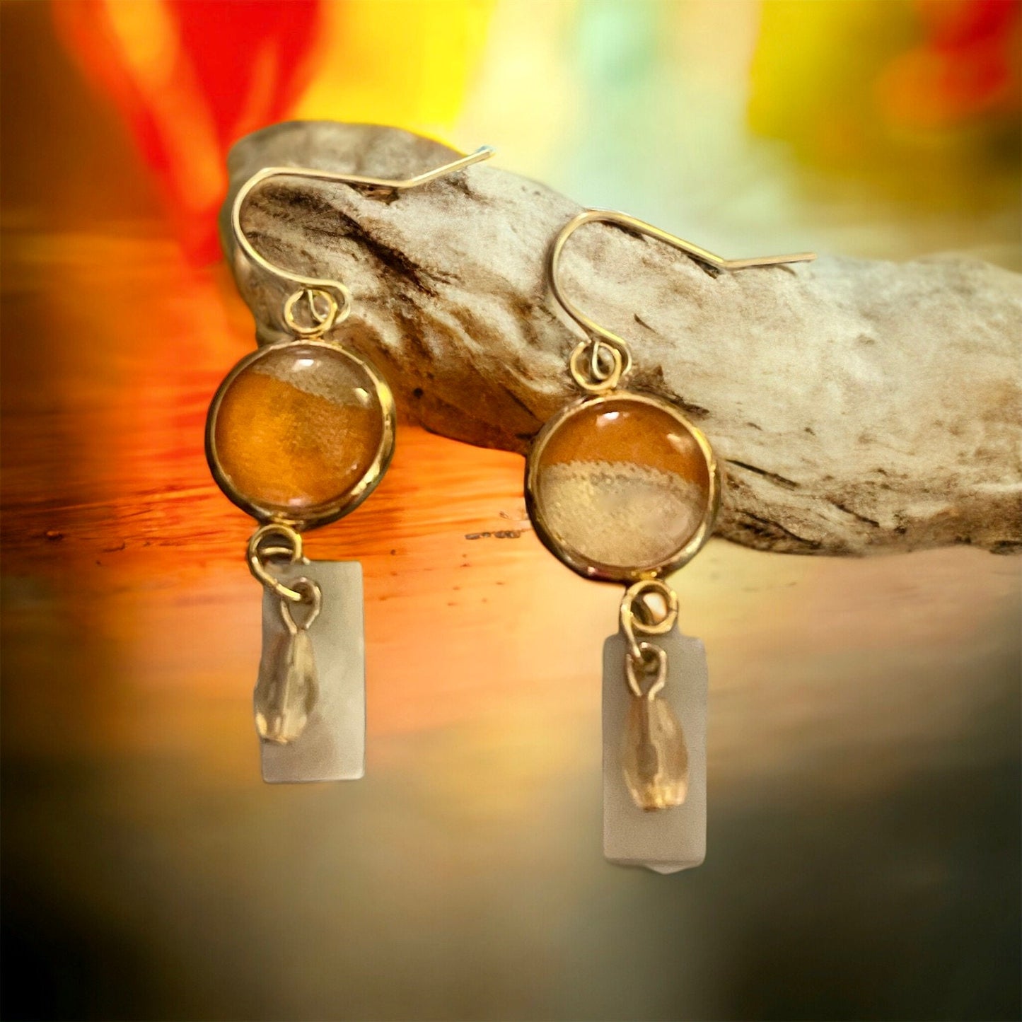 Orange and cream fabric inlaid glass cabochon earrings with rectangular mother of pearl and pale orange dangles