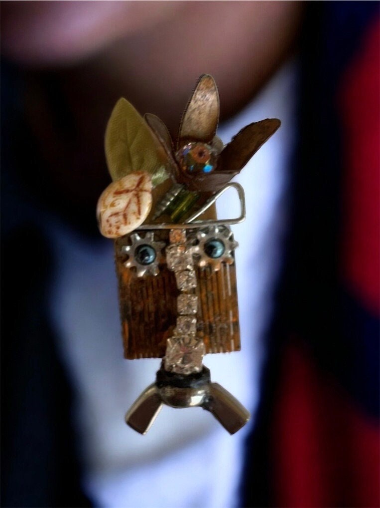 Meet "Gert" a mixed material piece made of parts of a vintage Swiss music box, along with hardware - pin or necklace pendant