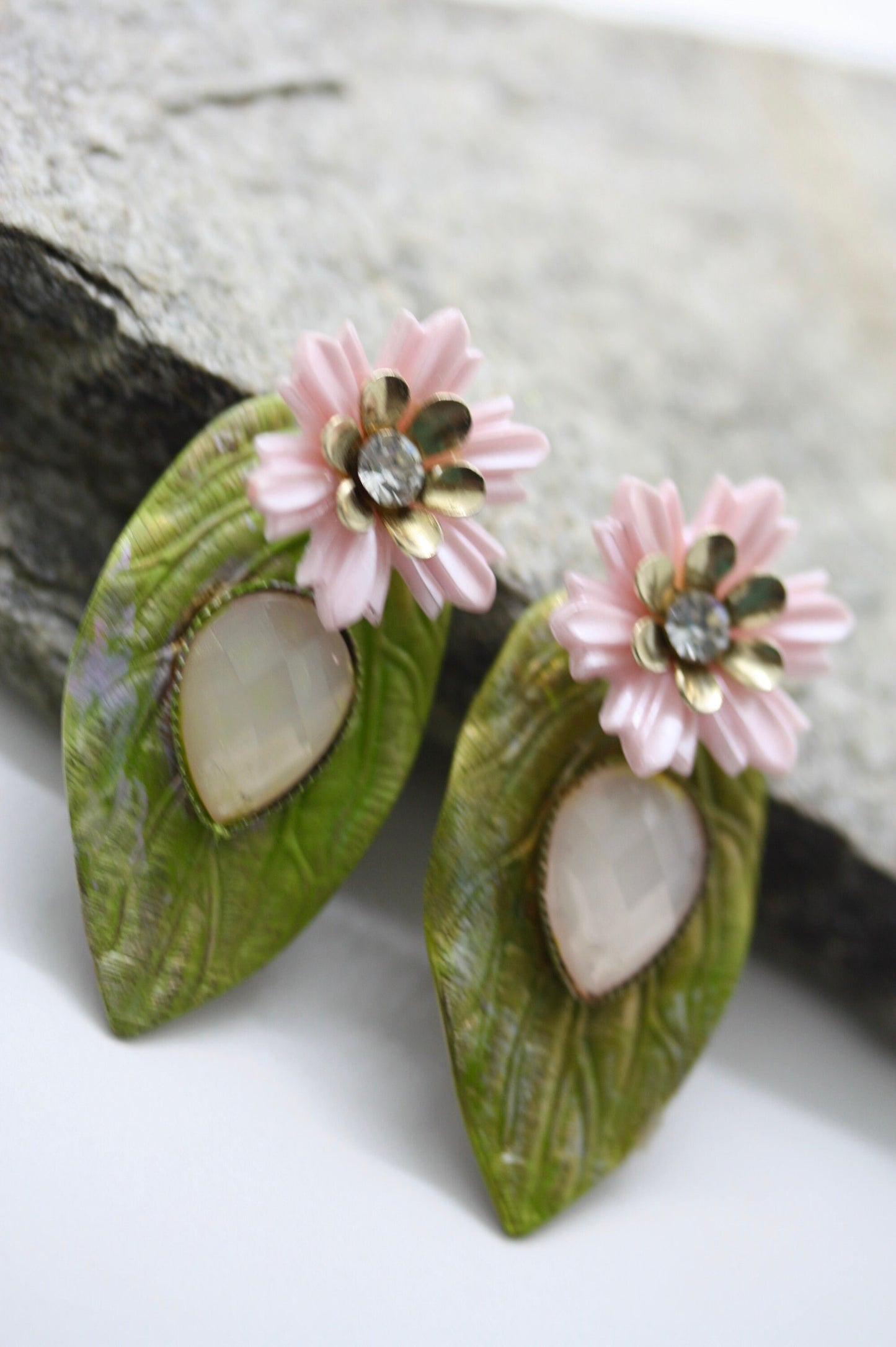 Hand painted leaf earrings with inlaid cabochan, vintage mixed material pink and metal flowers and capped off with rhinestone center