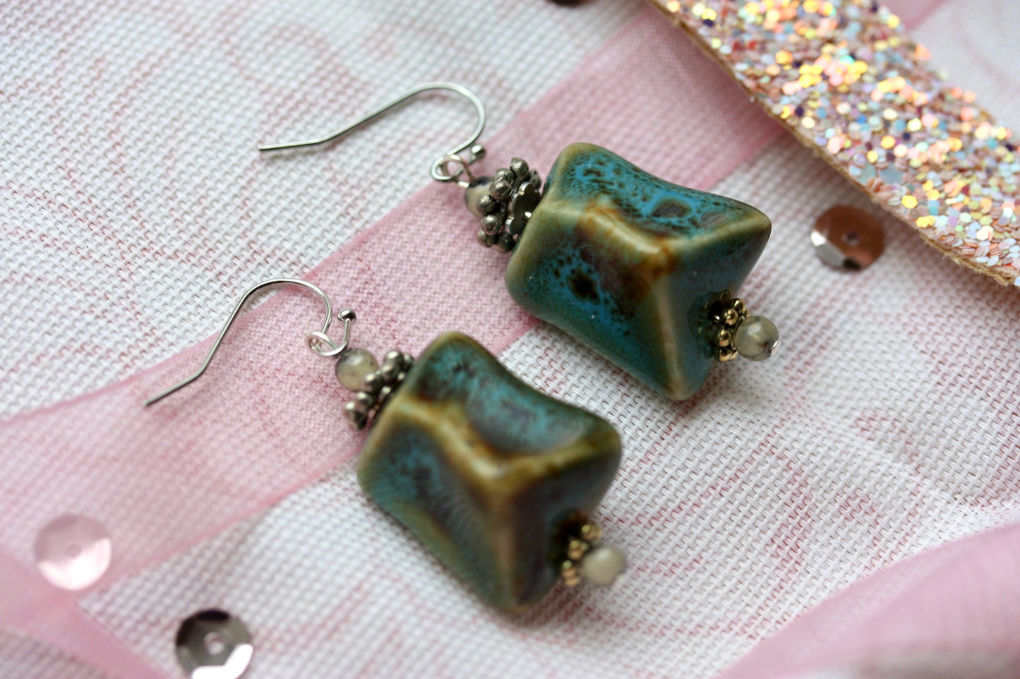 Handmade dangle earrings made with uniquely shaped faux turquoise beads