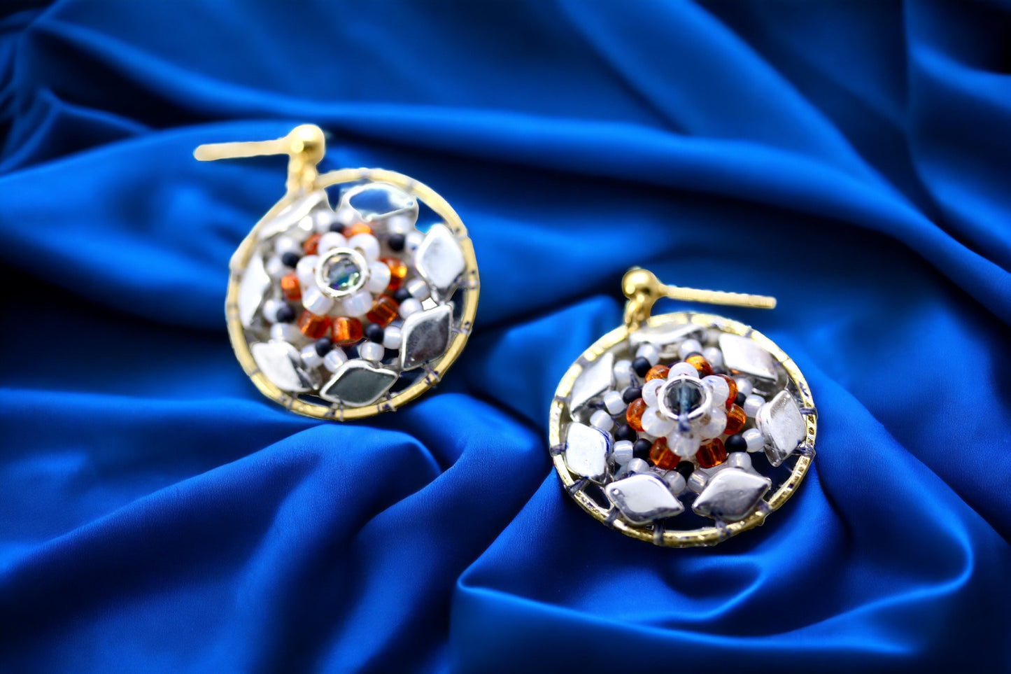 Orange and navy blue intricate beadwork small circular dangle earrings