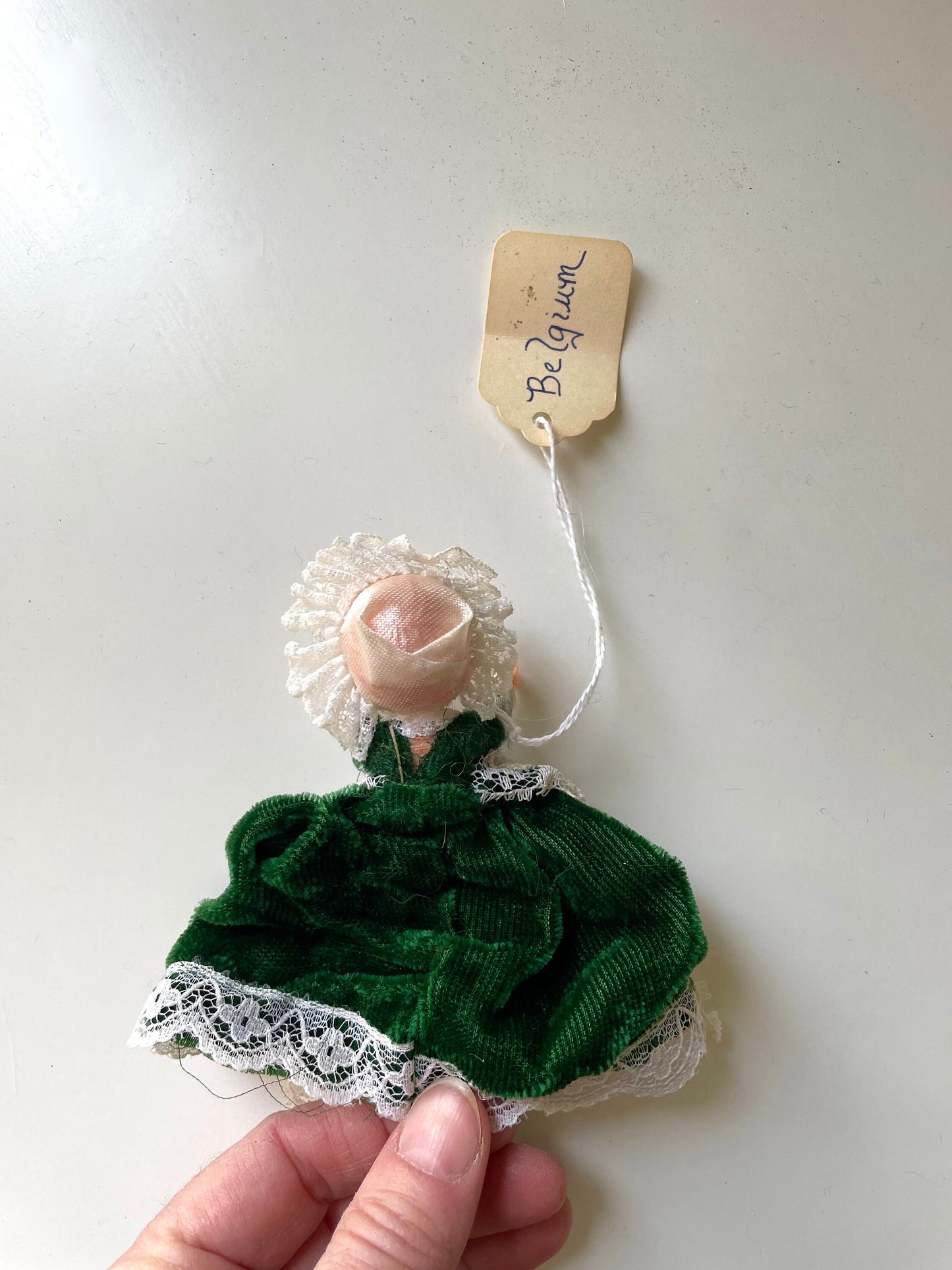 Stunning vintage collectible art baby Doll from Belgium with green velvet dress and lace overlay