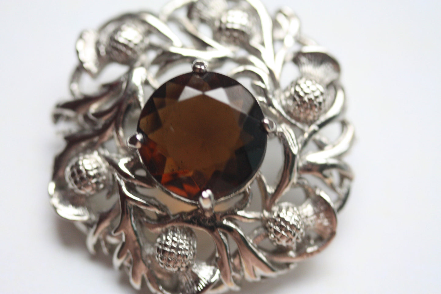 Stunning vintage pin with faceted center