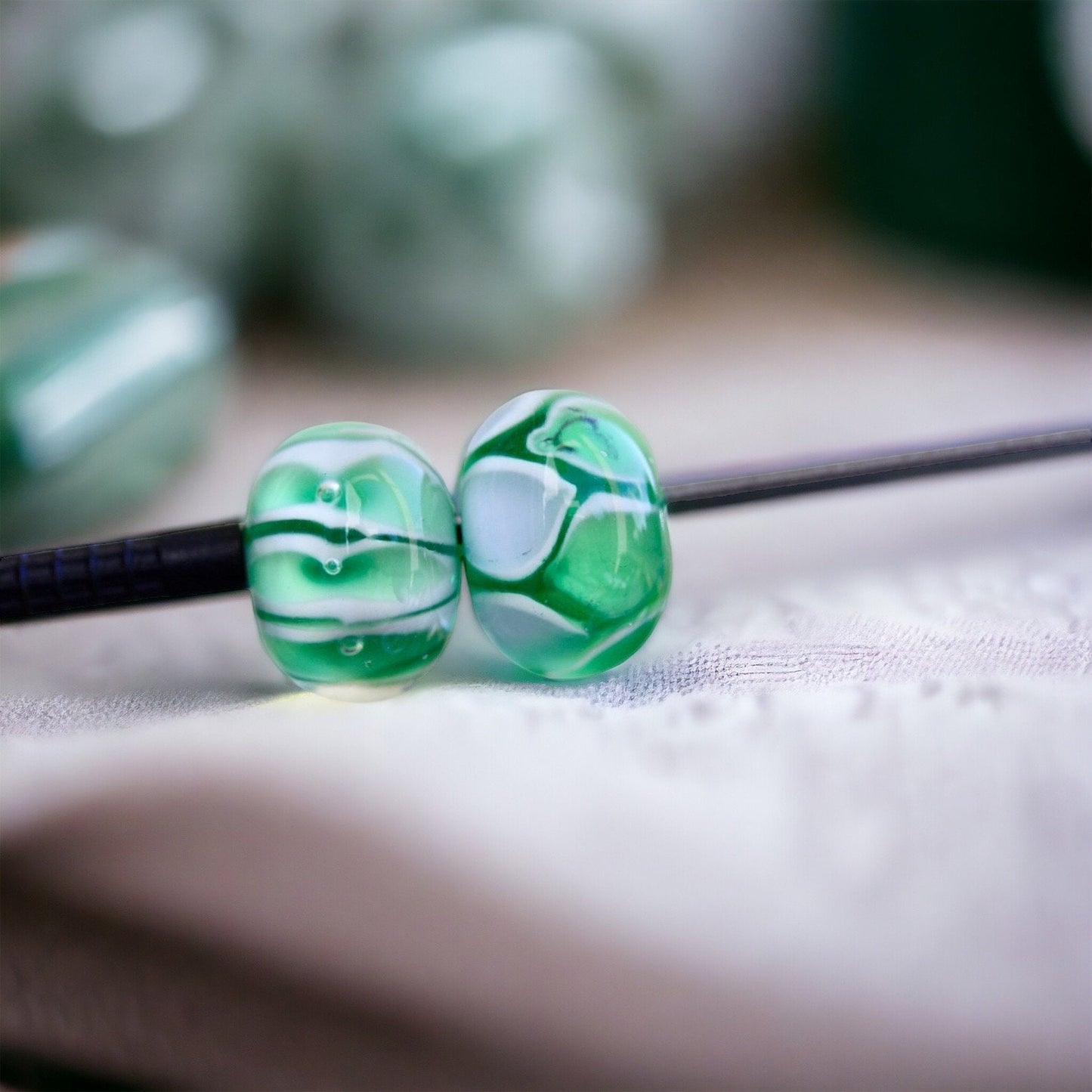 Two stunning vintage glass beads - shades of green and white