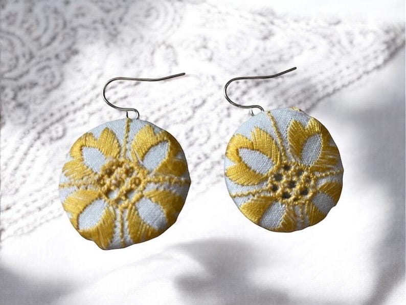 Choice of stud earrings, dangle earrings, hair combs, shanked buttons or pins all hand made from a vintage linen embroidered table runner