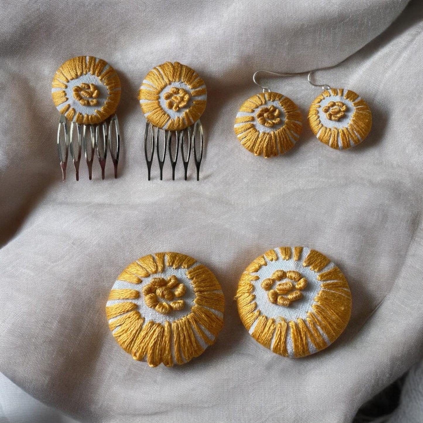 Choice of stud earrings, dangle earrings, hair combs, shanked buttons or pins all hand made from a vintage linen embroidered table runner