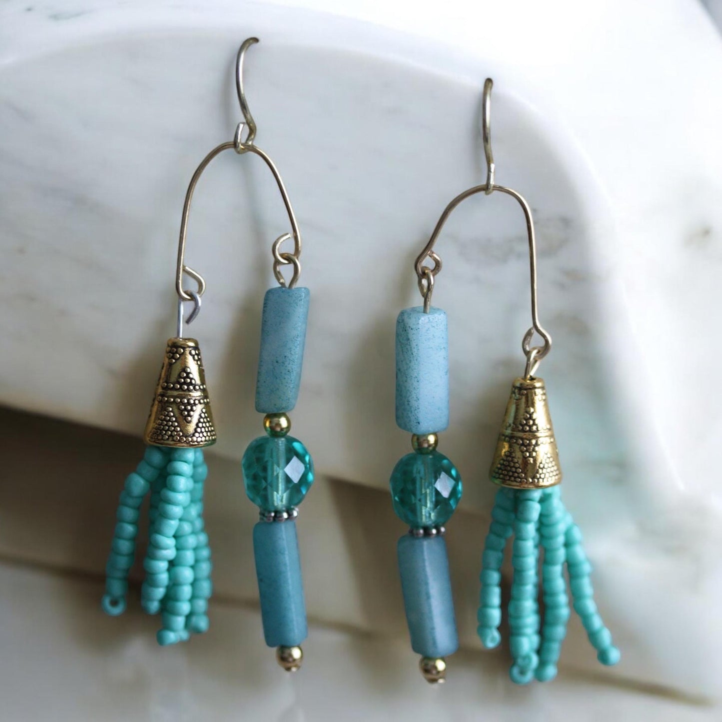 Asymmetrical mixed material turquoise crystal, stone and seed beads with goldtone trim - 2 and one-half" long earrings