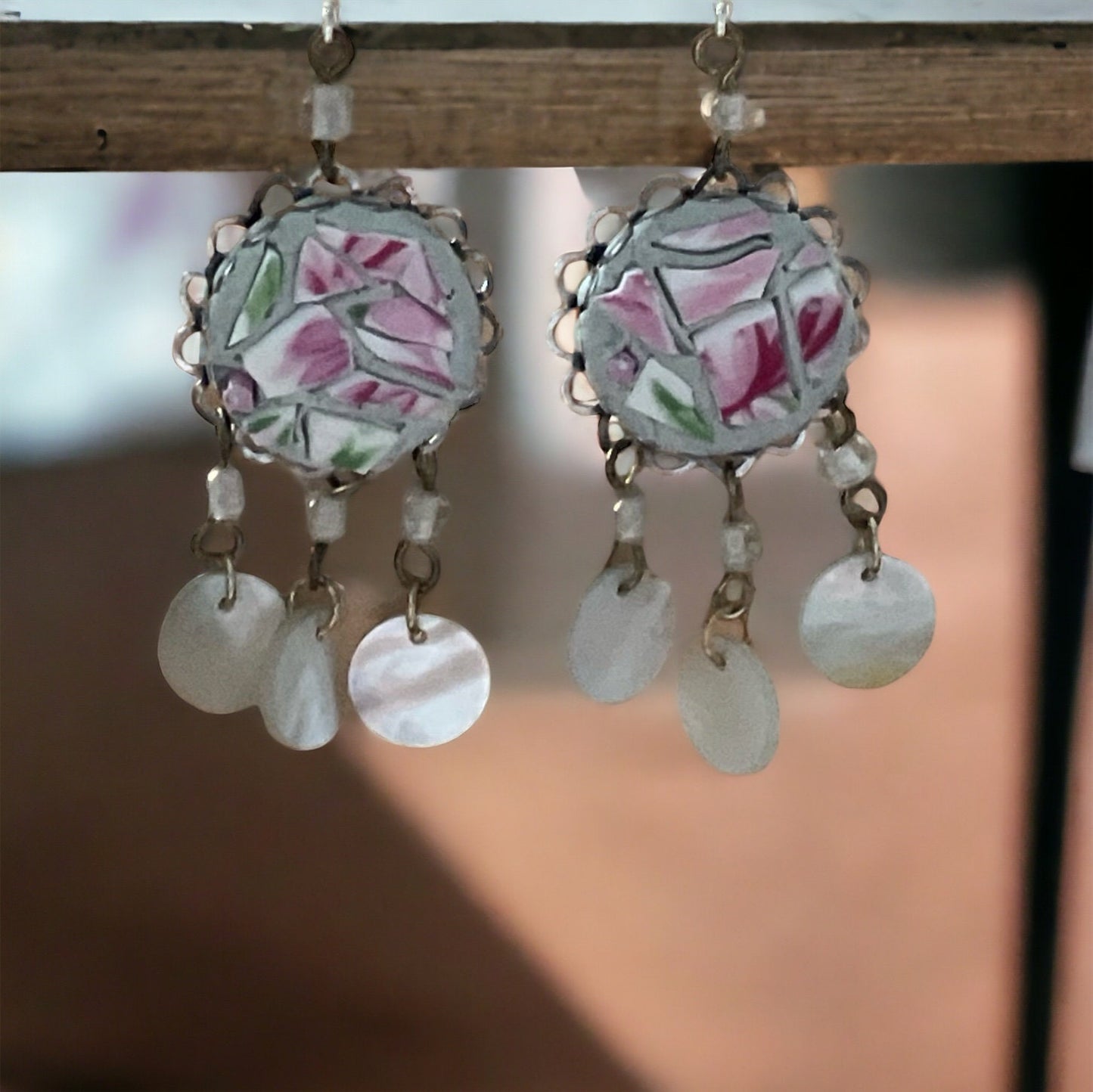 Unique earrings made of hand cut mosaic tile from vintage plates combined with mother of pearl dangles