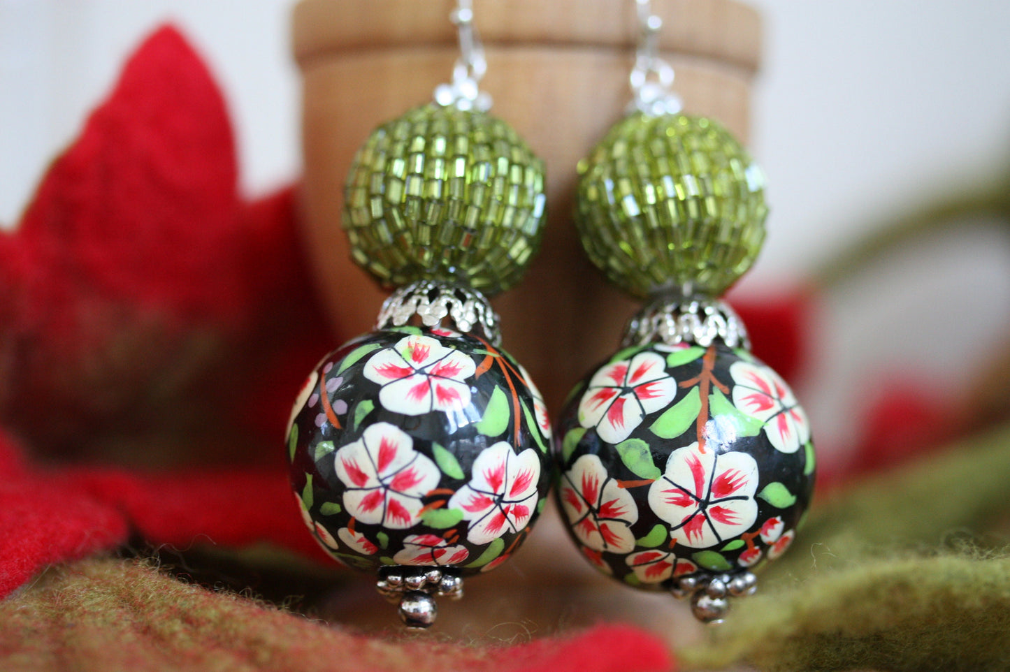 Green beaded bead and floral painted wood dangle earrings
