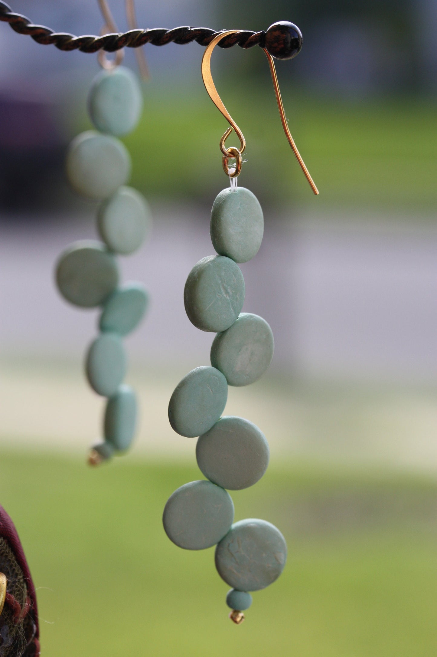 Handsewn aqua tinted wooden disk Scandinavian-inspired earrings - with sloped goldstone ear wires