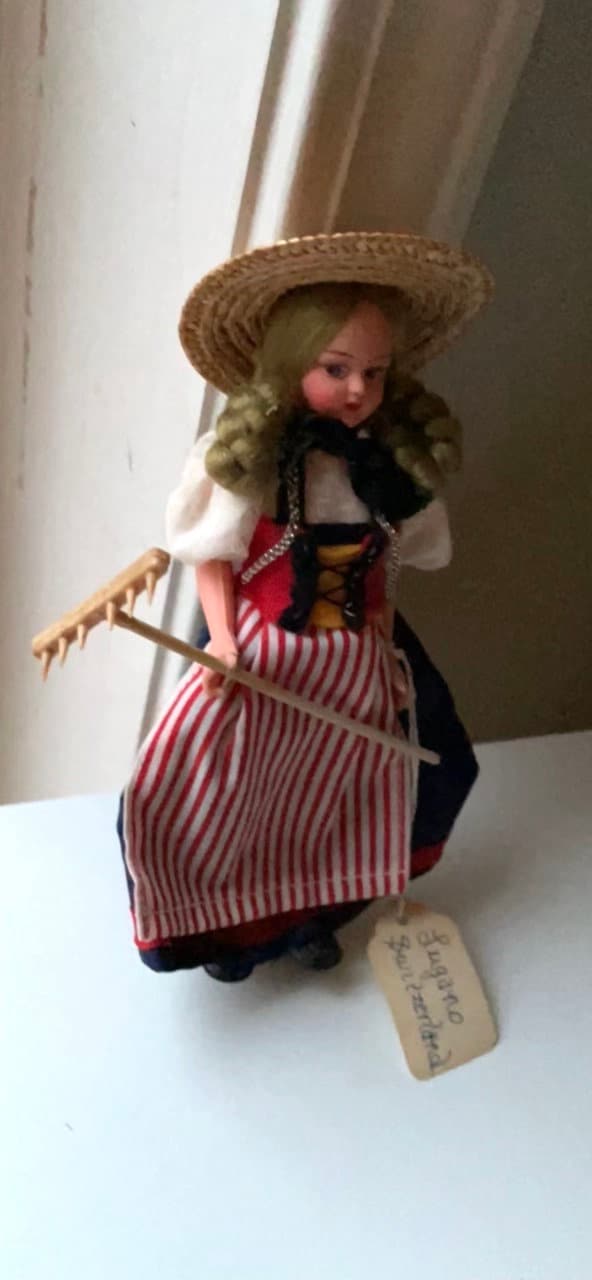 Vintage collectible handmade doll from Luganos Switzerland - with traditional handmade clothing and wooden rake