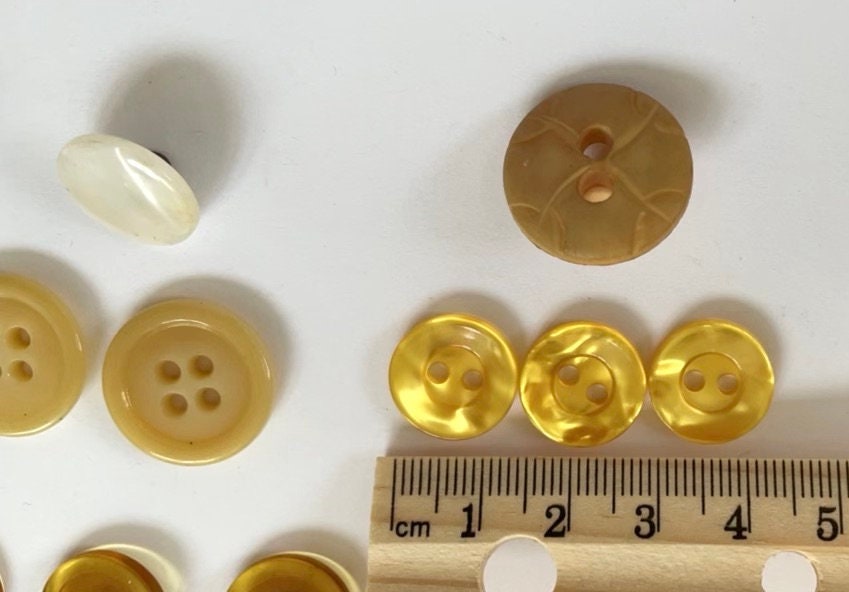 Lot of vintage buttons - from Holland and elsewhere - shades of yellow, gold and cream