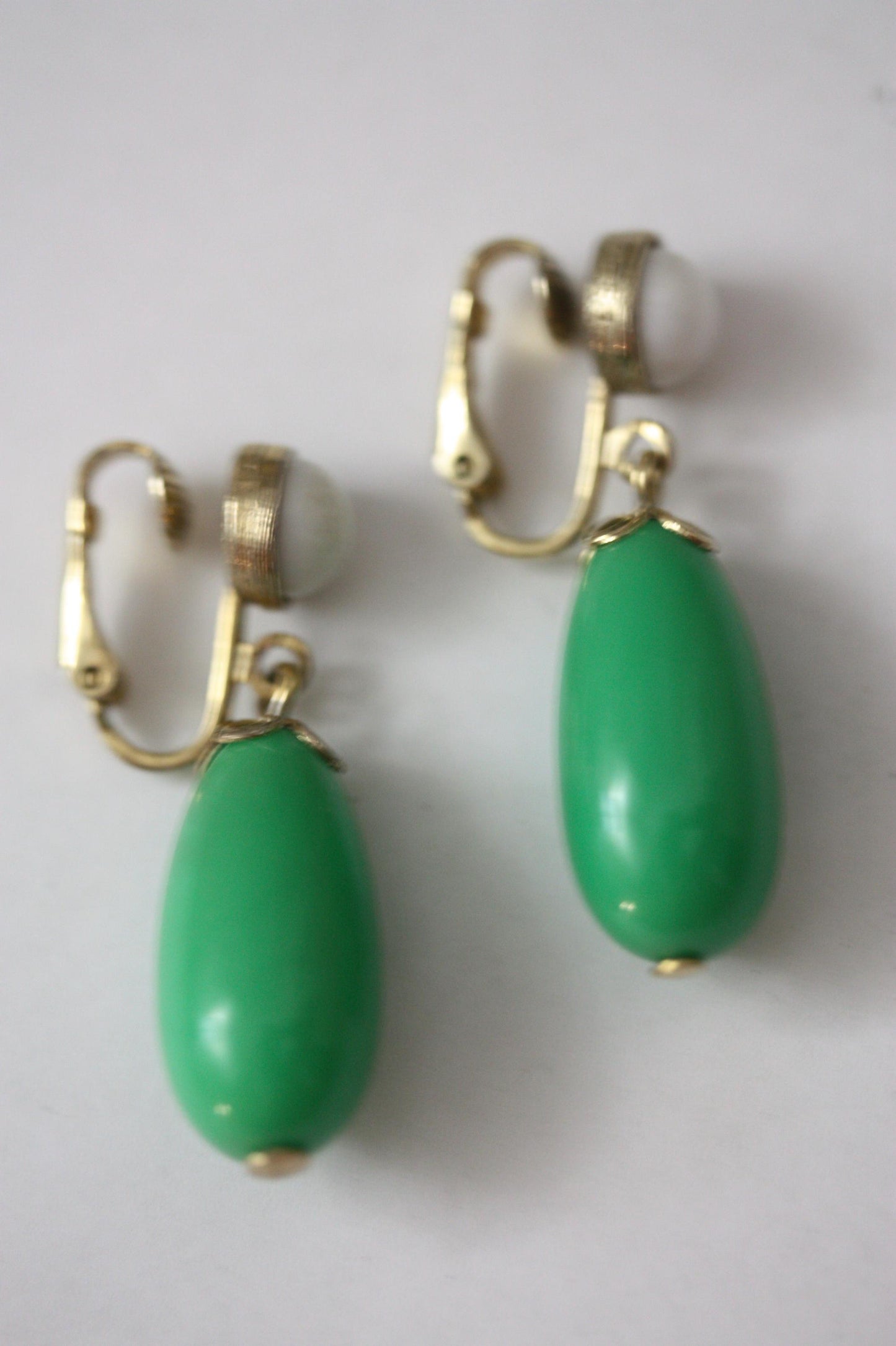Green and white vintage Avon clip on dangle earrings