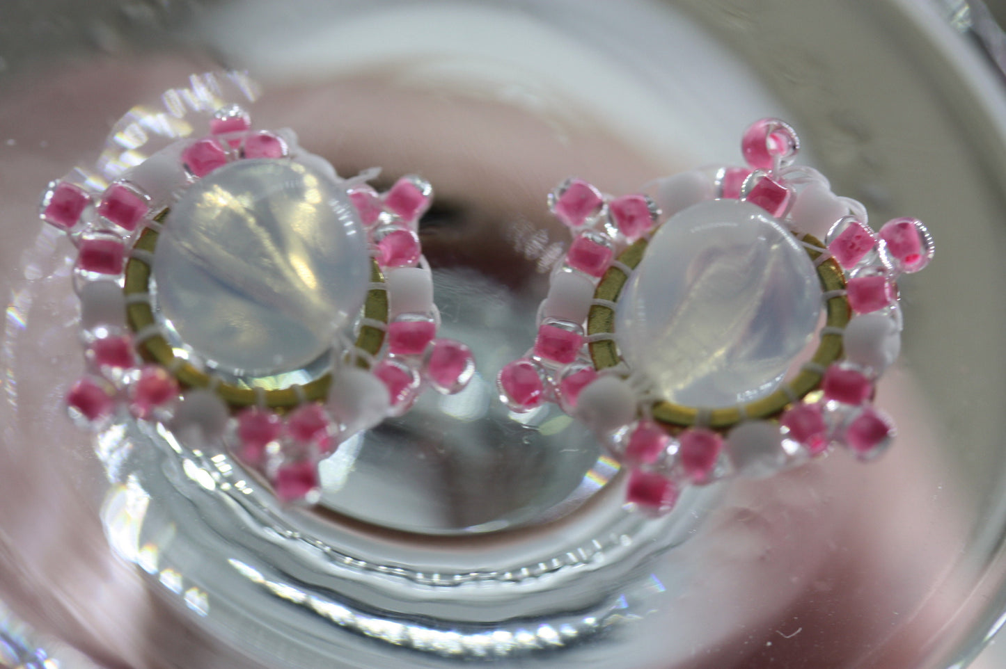 Hand beaded stud earrings - pink and white beadwork around transluscent opalescent glass bead