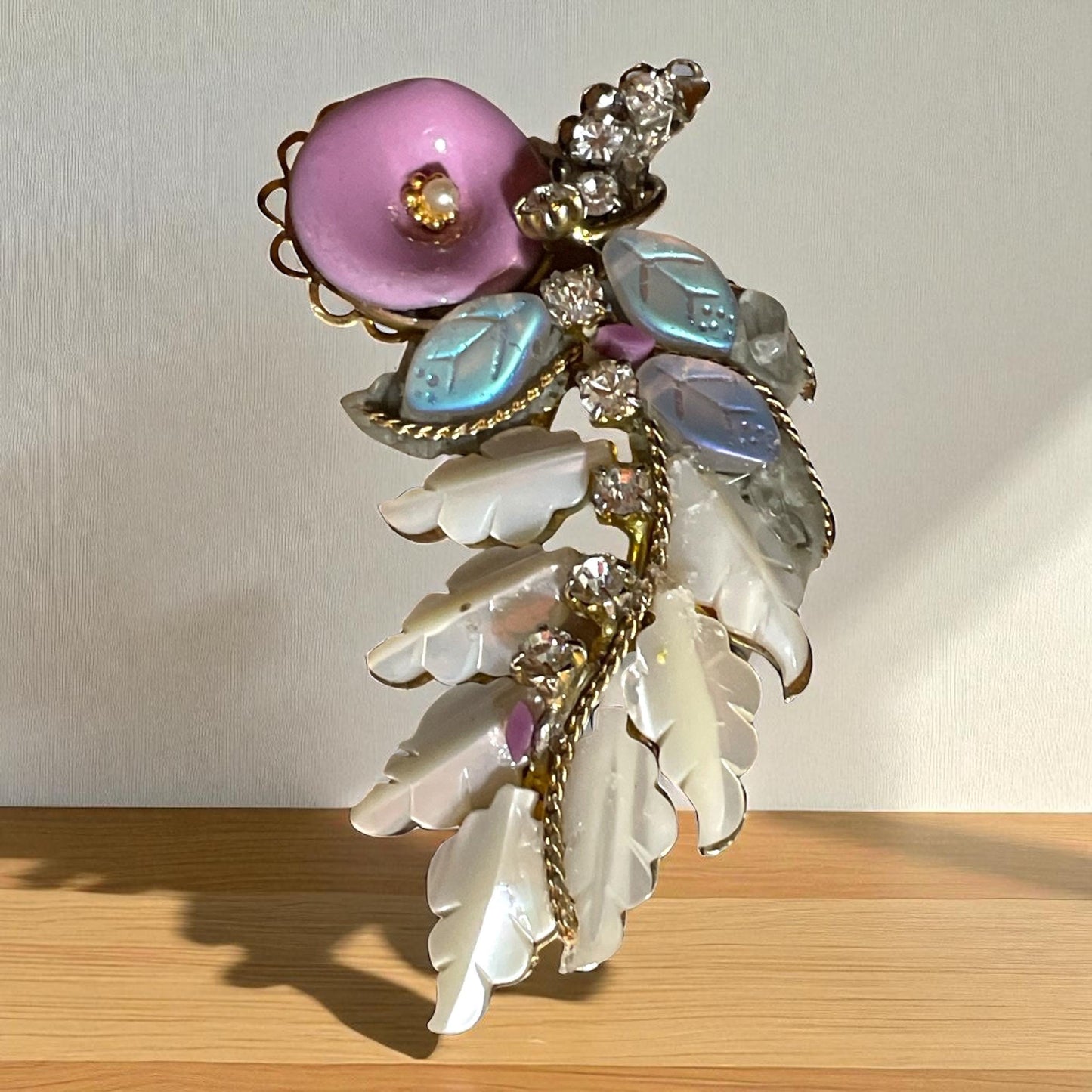Unique mixed material brooch pin - pink enameled flower with faux pearl center, mother of pearl & white iridescent glass leaves, rhinestones