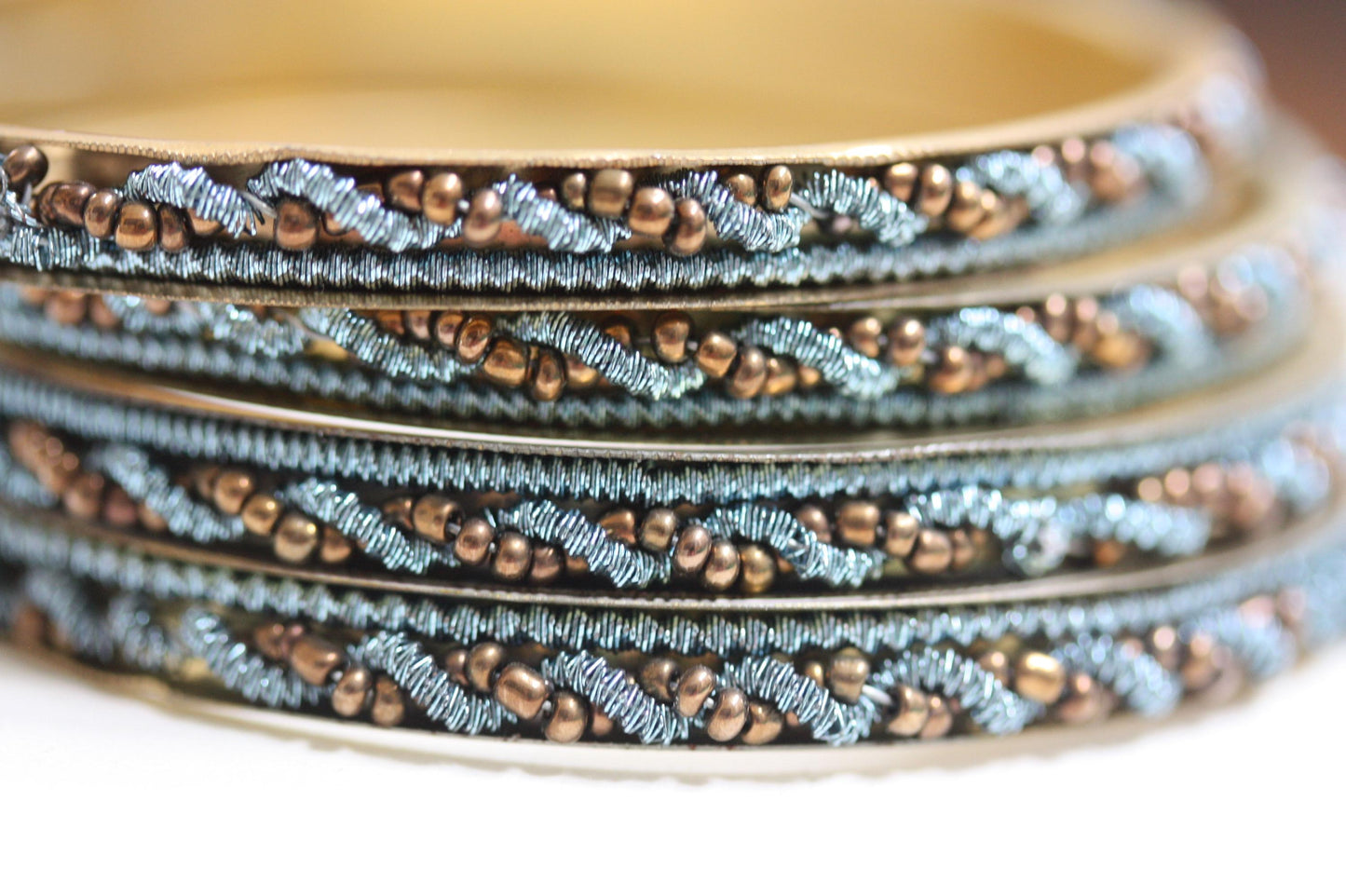 Set of 4 beautiful beadwork and metal bangle bracelets