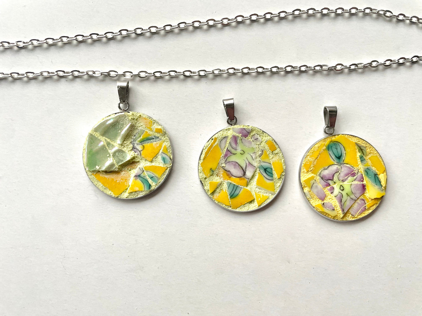 One-of-a-kind mosaic necklaces made from broken vintage dishes