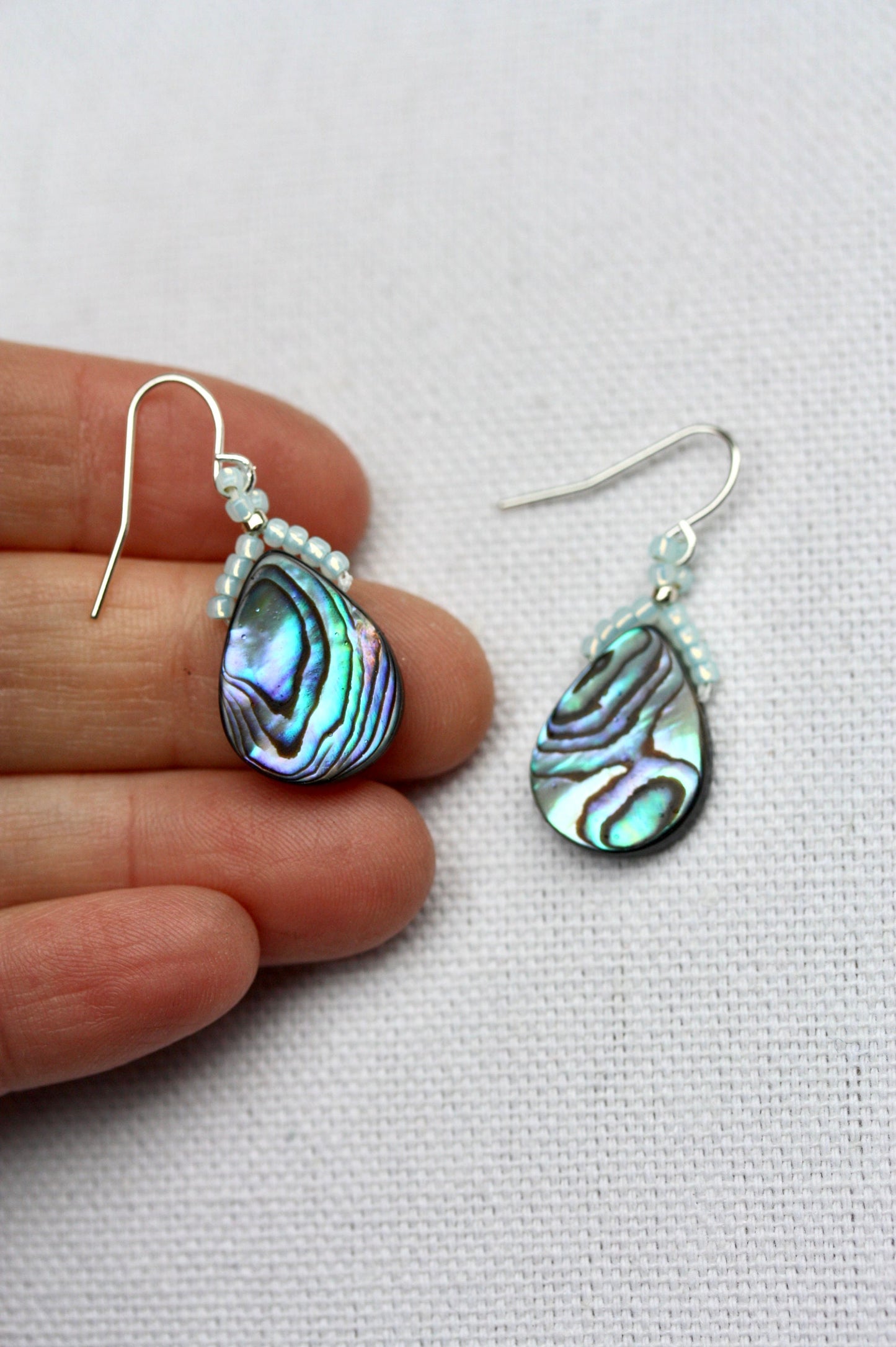 Beaded abalone shell teardrop shaped dangle earrings with sterling silver ear wires