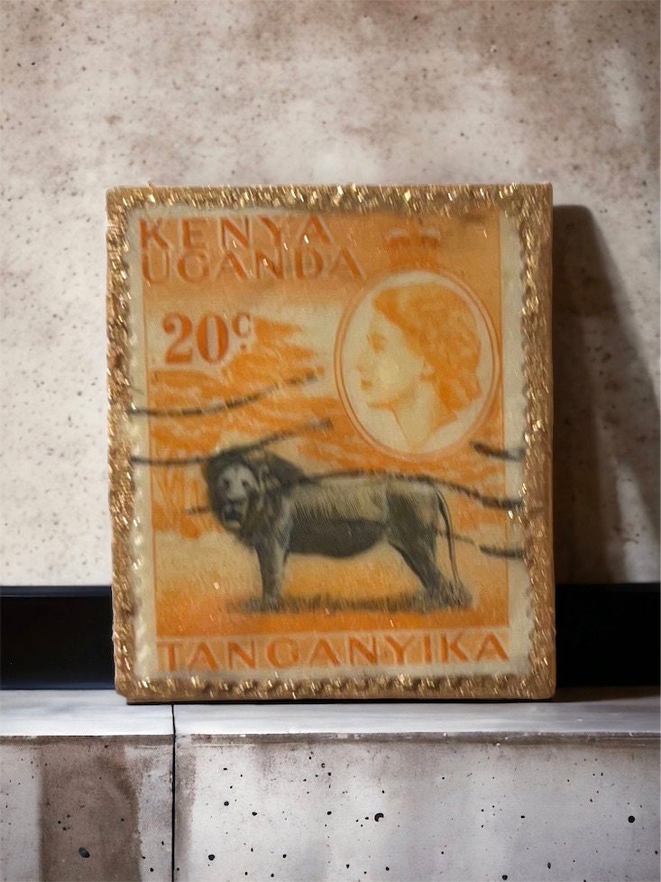 Pin or necklace pendant hand made from genuine vintage and antique postage stamps from around the world - East Africa, lion, Queen Elizabeth