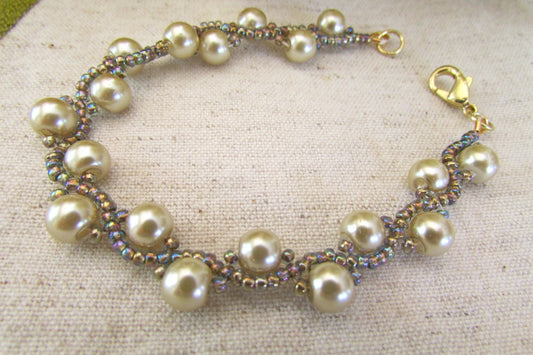 Light copper tone glass pearls with iridescent glass seed beads (in various hues) handmade beaded bracelet