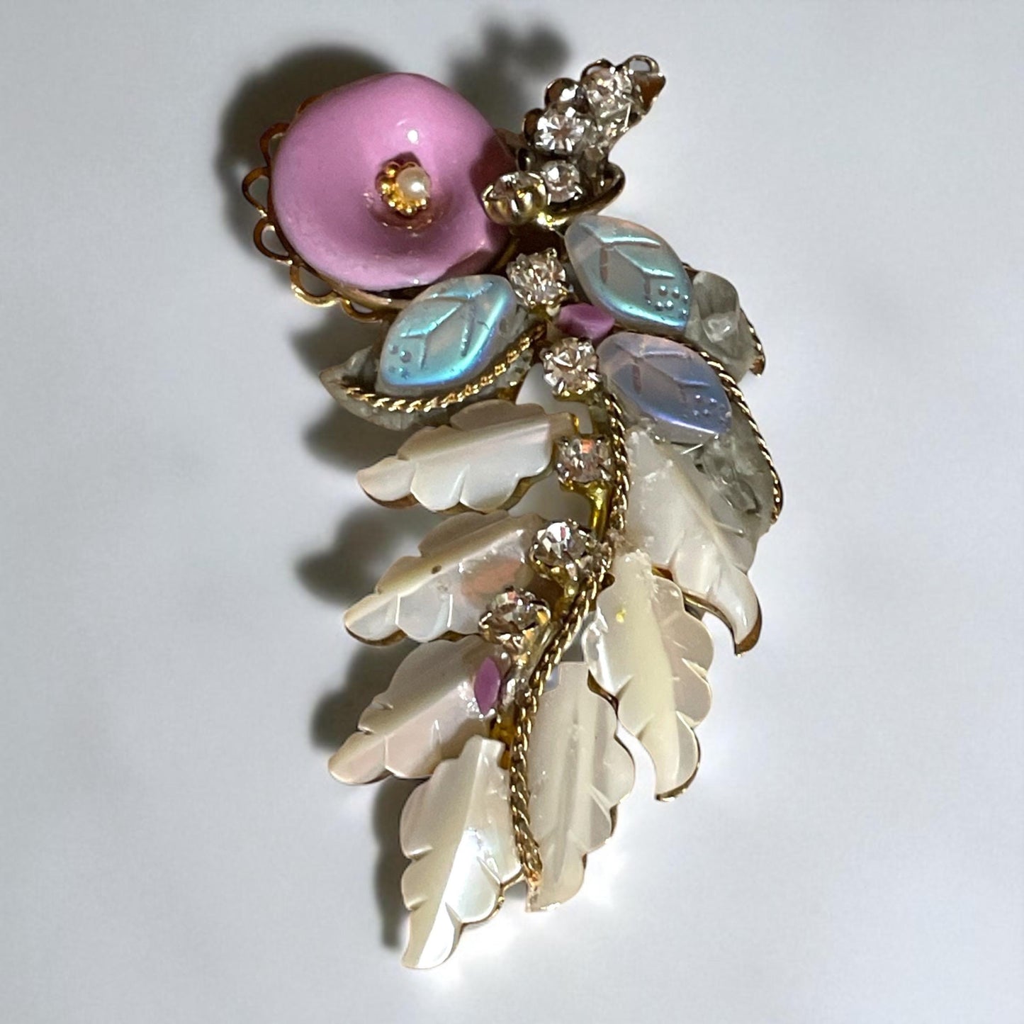 Unique mixed material brooch pin - pink enameled flower with faux pearl center, mother of pearl & white iridescent glass leaves, rhinestones