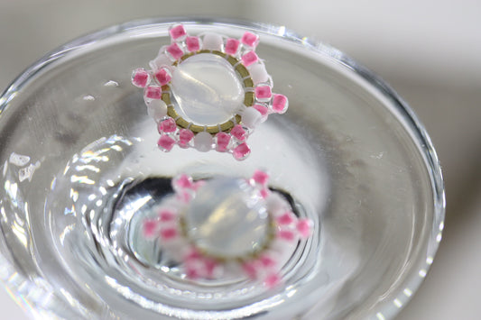 Hand beaded stud earrings - pink and white beadwork around transluscent opalescent glass bead