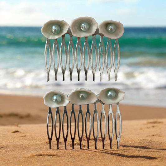 Pair of Hair combs made of white shells with light blue pearl centers