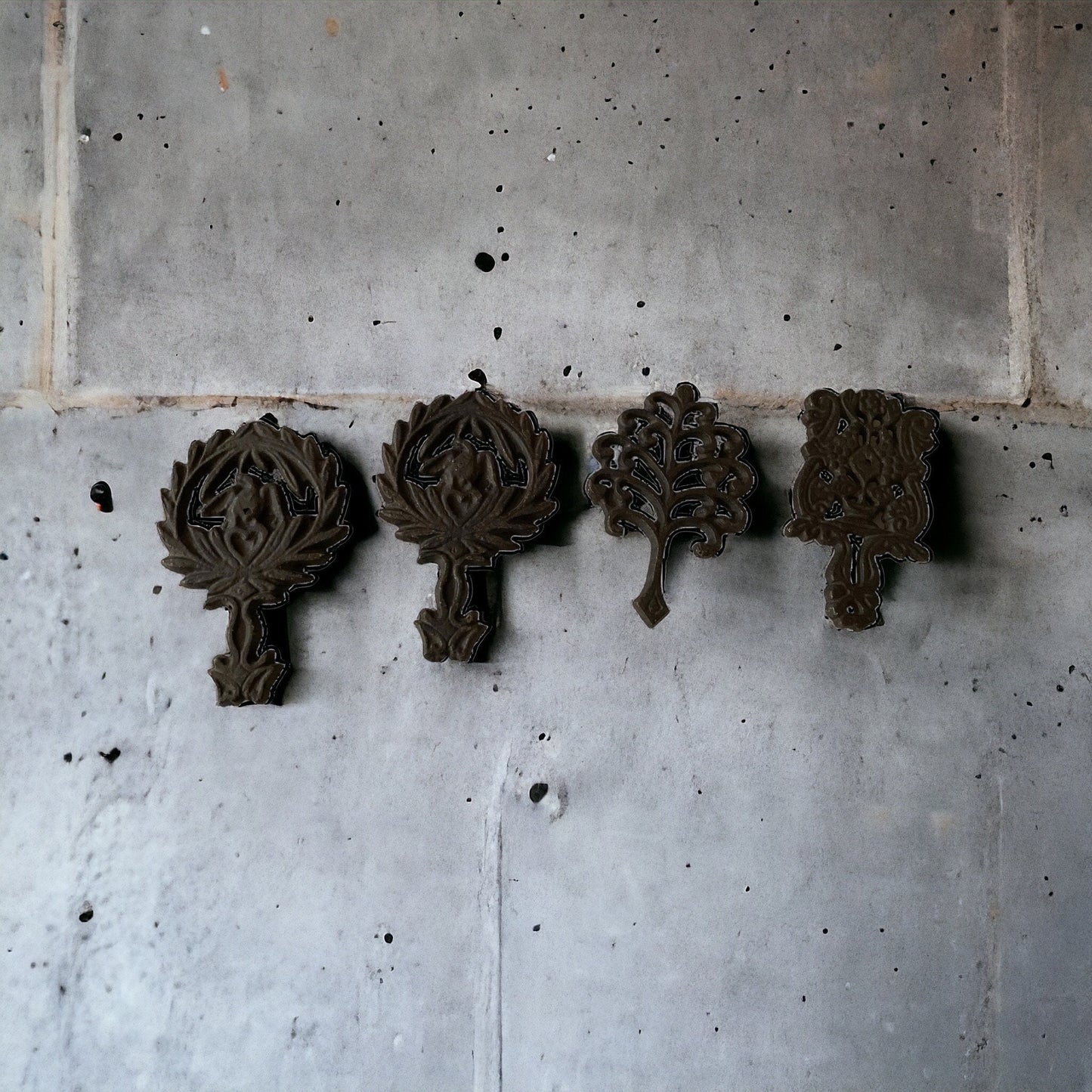 Set of 4 small cast iron trivets - vintage or antique?